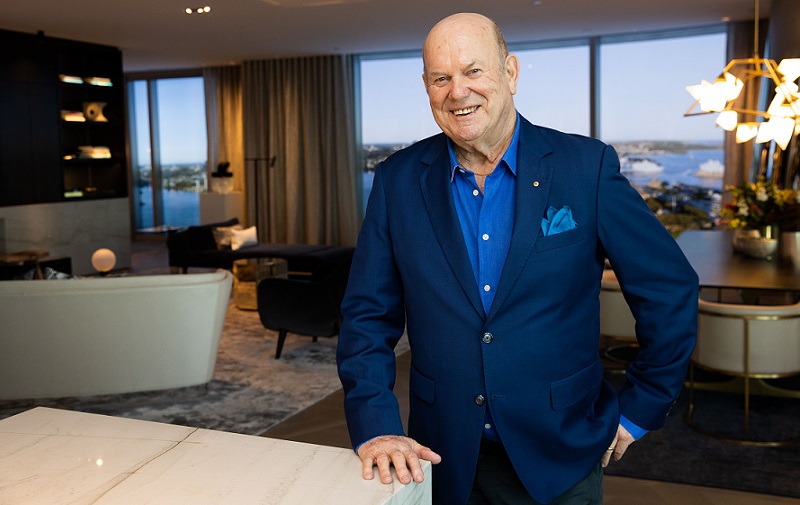 Trevor Rowe in a blue suit at his new apartment in Crown Residences at One Barangaroo overlooking Sydney Harbour.
